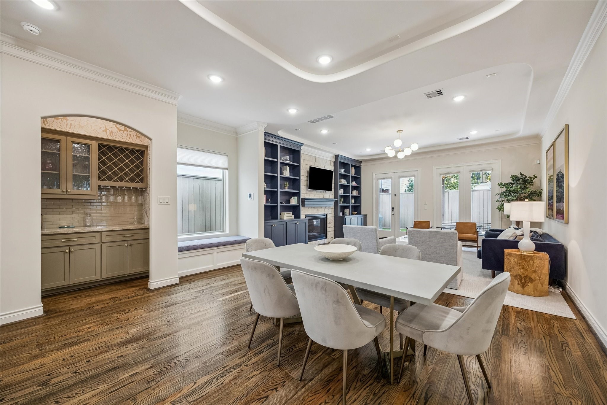 5305 Gibson Street Houston, TX 77007 - Photo 10 of 46 a view of a dining room with furniture wooden floor and a kitchen