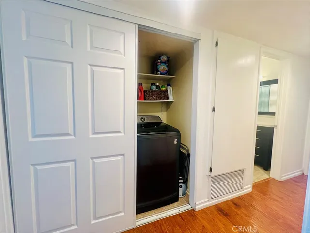 a bedroom with a bed and cabinets