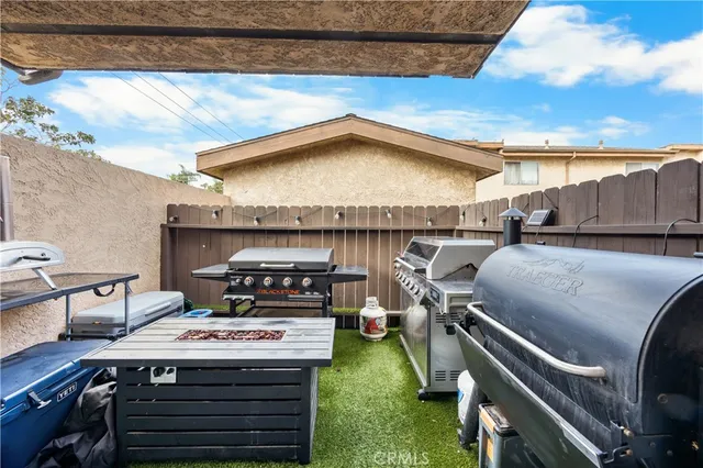 a view of a patio with table and chairs with wooden floor