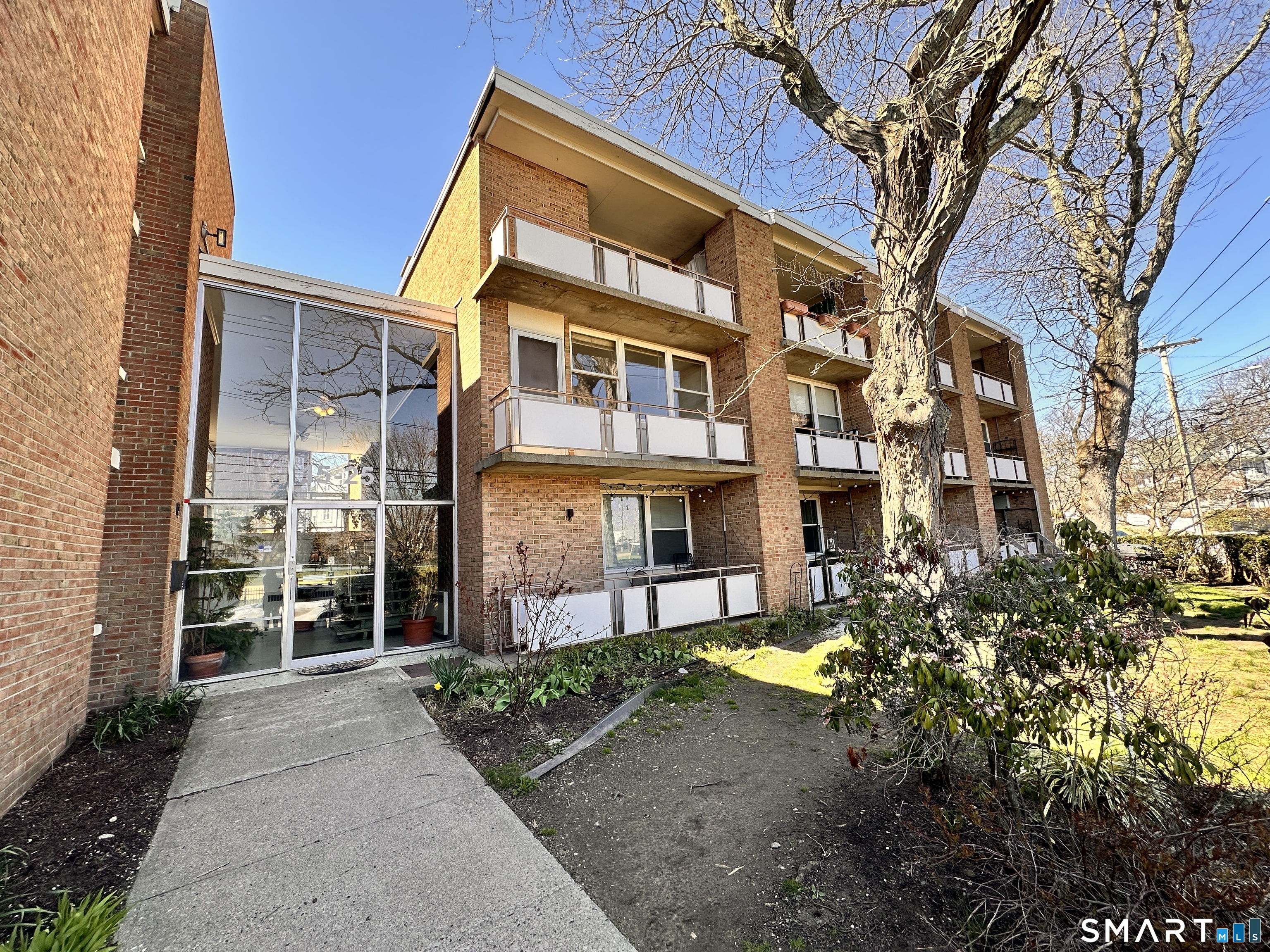 25 Ellsworth Street, Unit 17 Bridgeport, CT 06605 - Photo 1 of 30 a view of a building with a yard