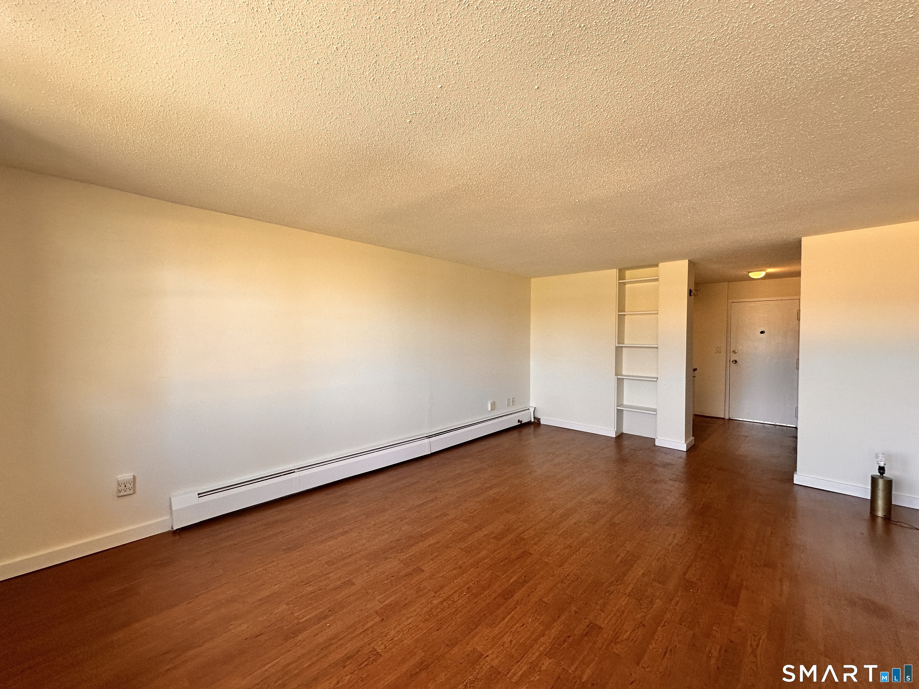 25 Ellsworth Street, Unit 17 Bridgeport, CT 06605 - Photo 24 of 30 a view of an empty room and wooden floor