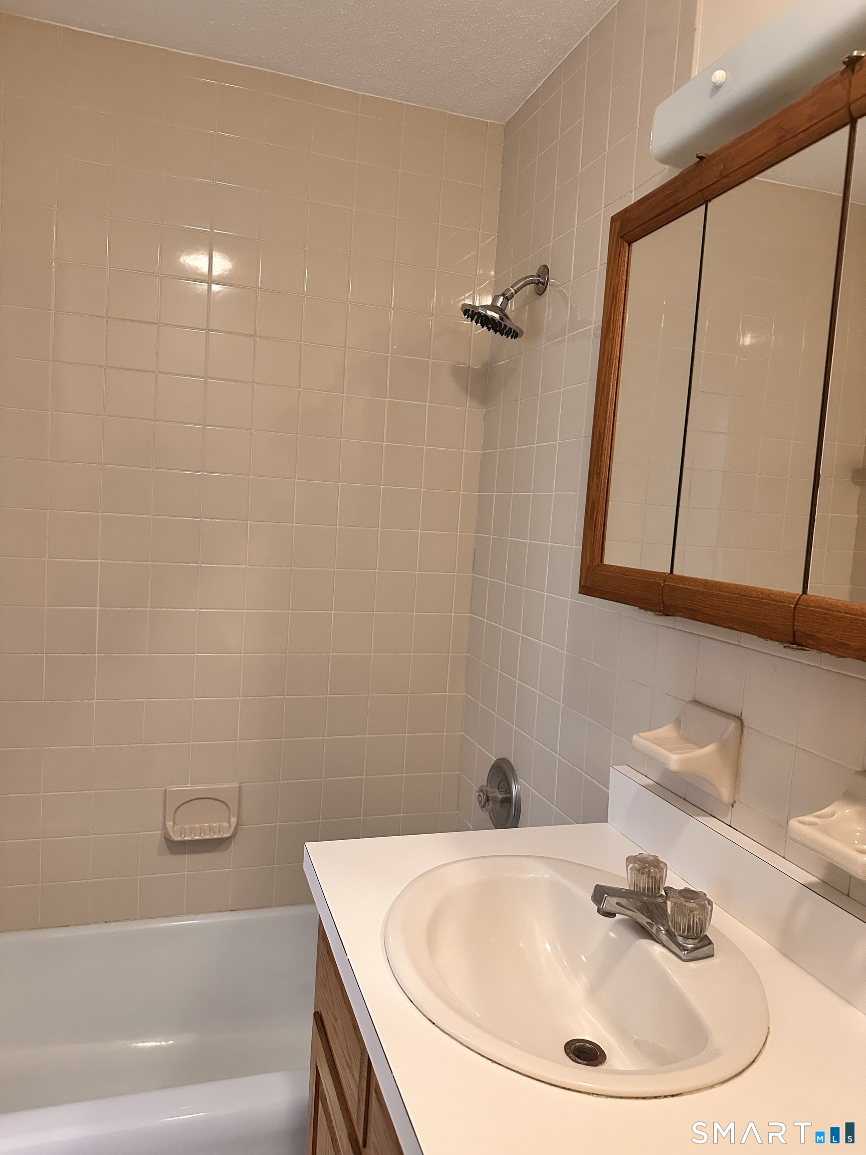 25 Ellsworth Street, Unit 17 Bridgeport, CT 06605 - Photo 9 of 30 a bathroom with a sink and a mirror
