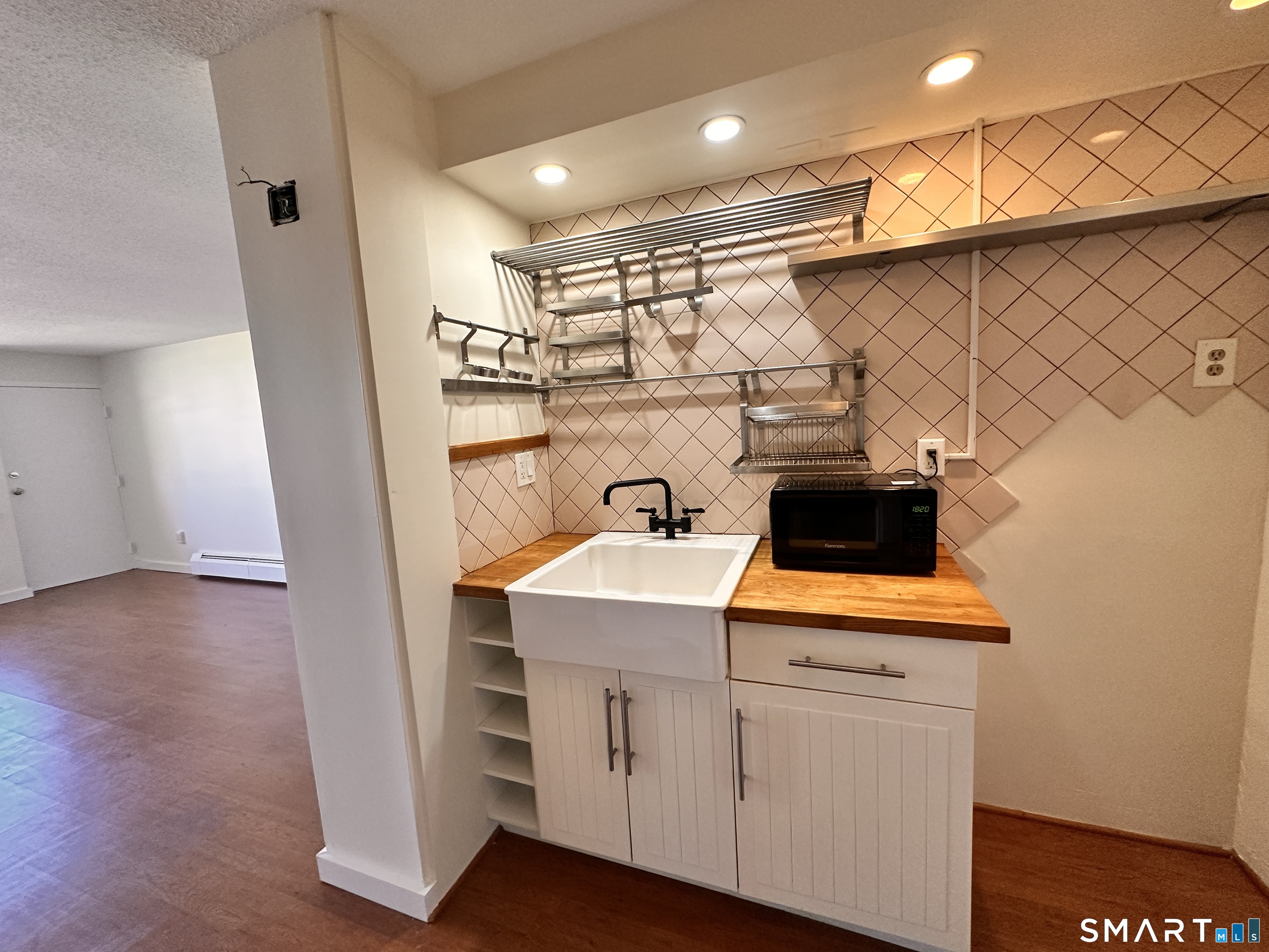 25 Ellsworth Street, Unit 17 Bridgeport, CT 06605 - Photo 10 of 30 a view of storage and utility room with a sink