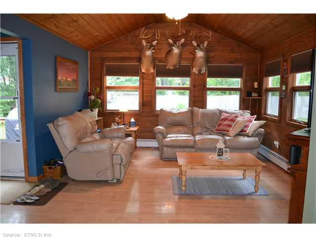81 S Road Ellington, CT 06029 - Photo 1 of 1 a living room with furniture and a large window