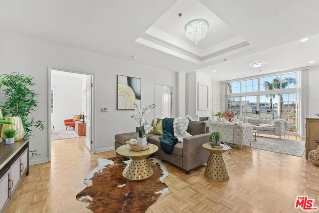 a living room with furniture and a clock