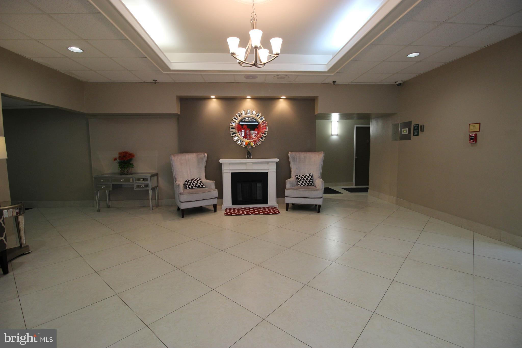 5911 Edsall Road, Unit 405 Alexandria, VA 22304 - Photo 18 of 23 a view of a livingroom with a fireplace