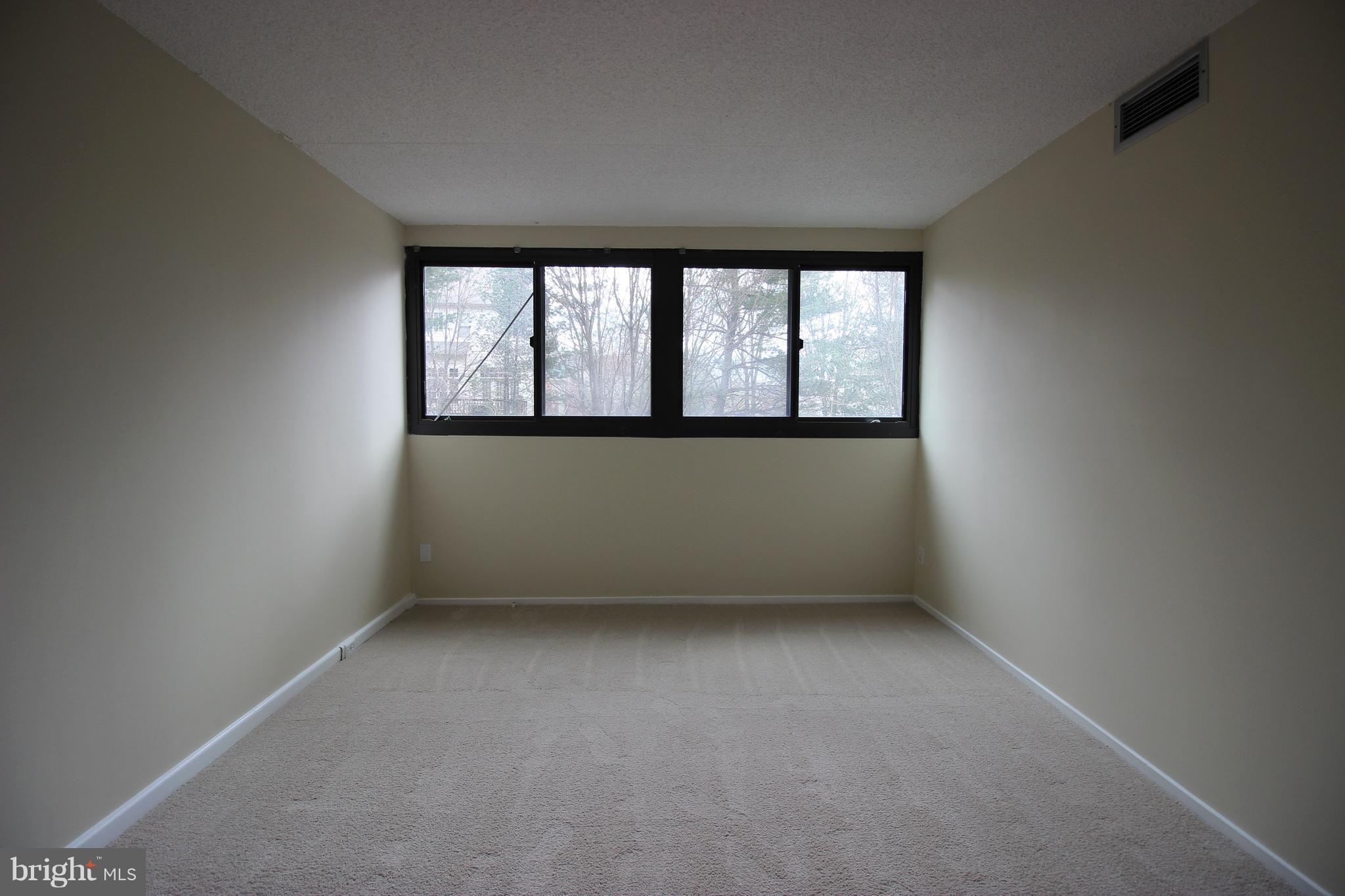 5911 Edsall Road, Unit 405 Alexandria, VA 22304 - Photo 9 of 23 an empty room with a window