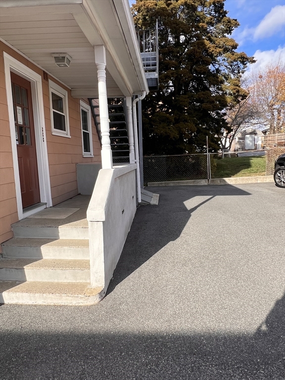 24 Proctor Street, Unit 2 Peabody, MA 01960 - Photo 17 of 19 a view of a house with a yard