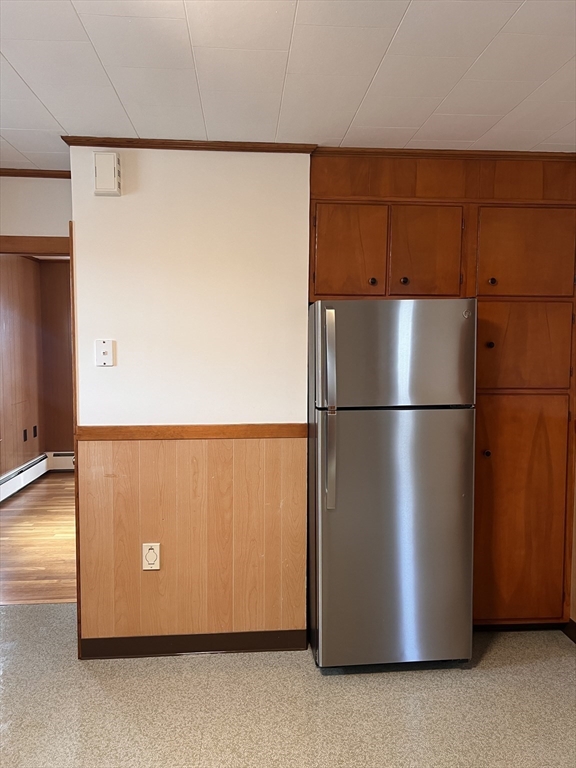 24 Proctor Street, Unit 2 Peabody, MA 01960 - Photo 5 of 19 a view of a refrigerator in a kitchen