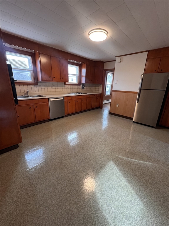 24 Proctor Street, Unit 2 Peabody, MA 01960 - Photo 6 of 19 a view of a kitchen with a sink cabinets and a kitchen
