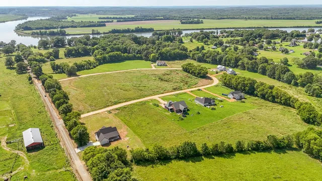 a view of a swimming pool with a yard
