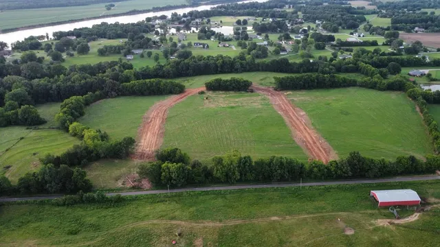 a view of a swimming pool with a yard