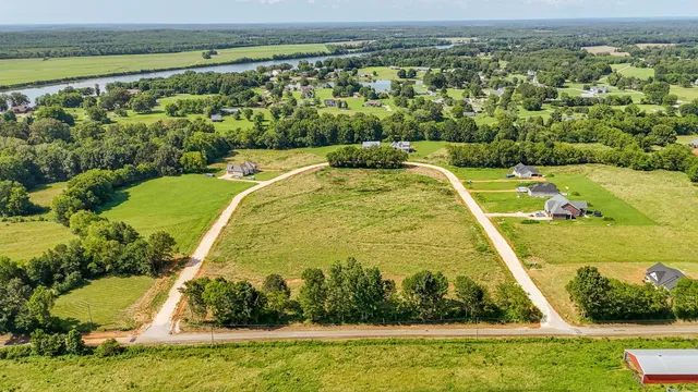 a view of a swimming pool with a yard