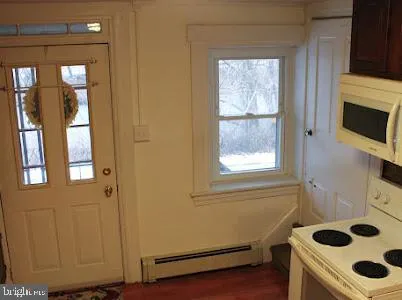 a room with a fireplace and a window