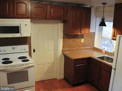 a kitchen with a stove and a microwave