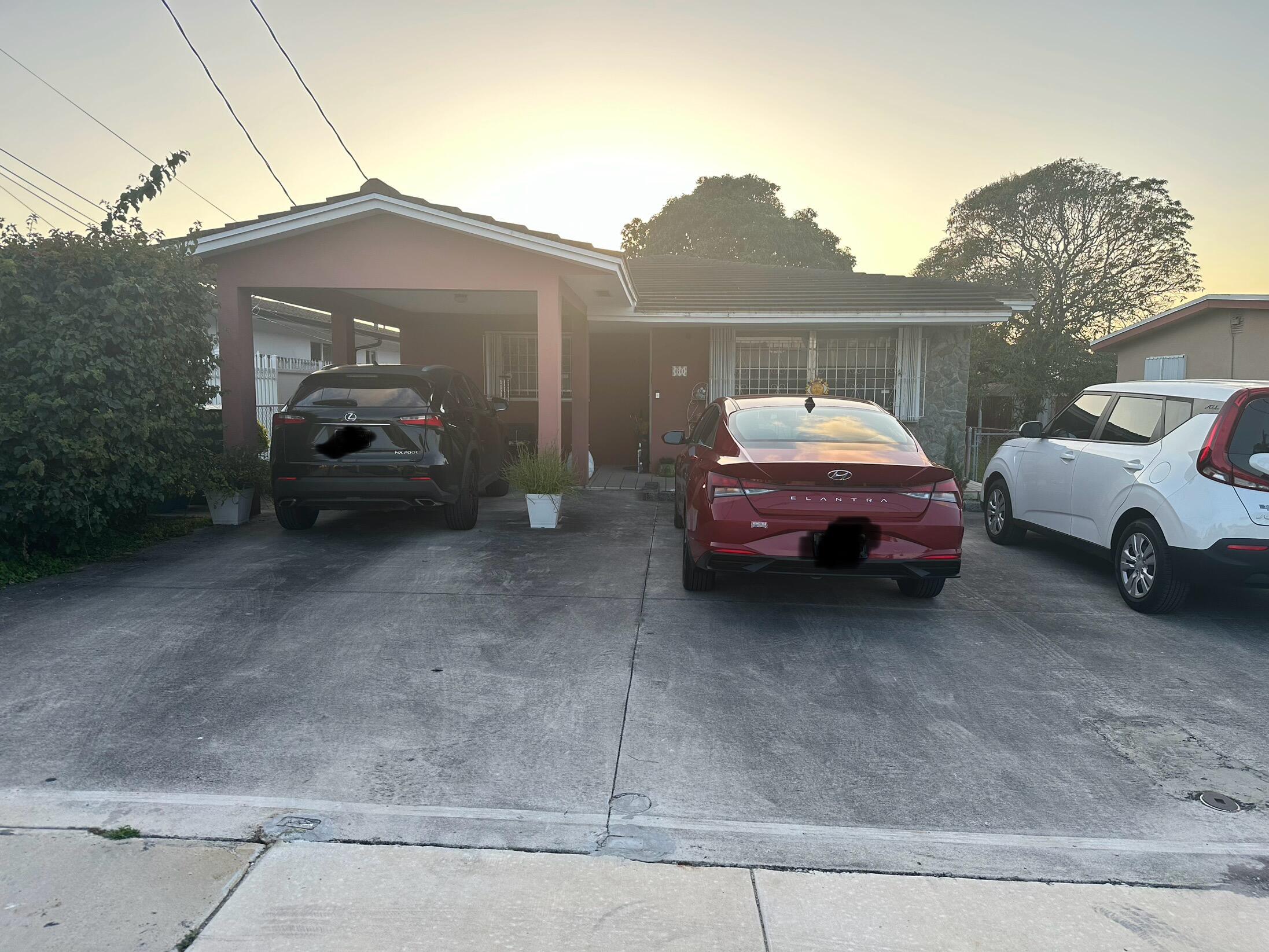 a car parked in front of a house