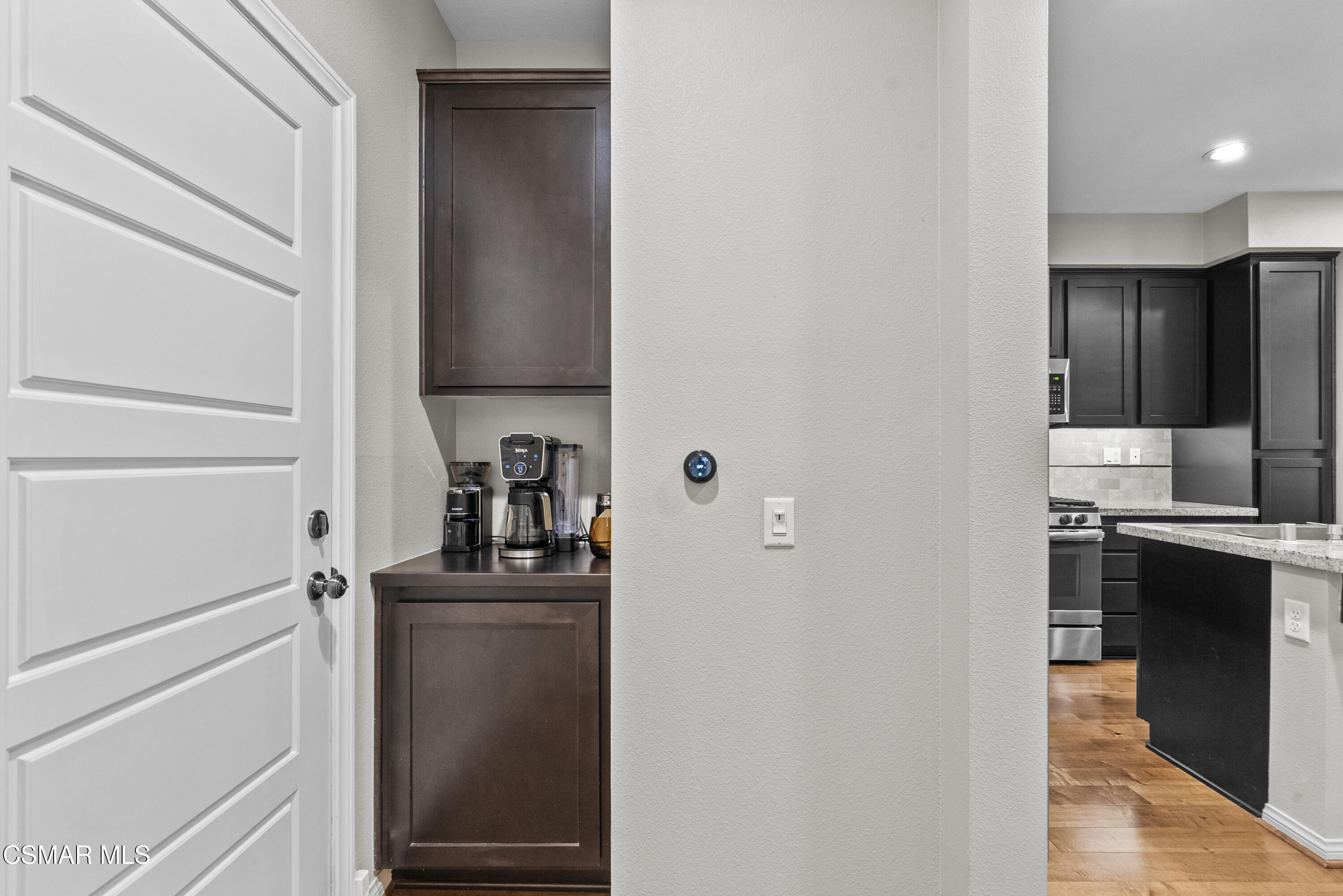 6441 Summit Village Lane, Unit 3 Simi Valley, CA 93063 - Photo 11 of 41 a kitchen with stainless steel appliances granite countertop a refrigerator and a stove
