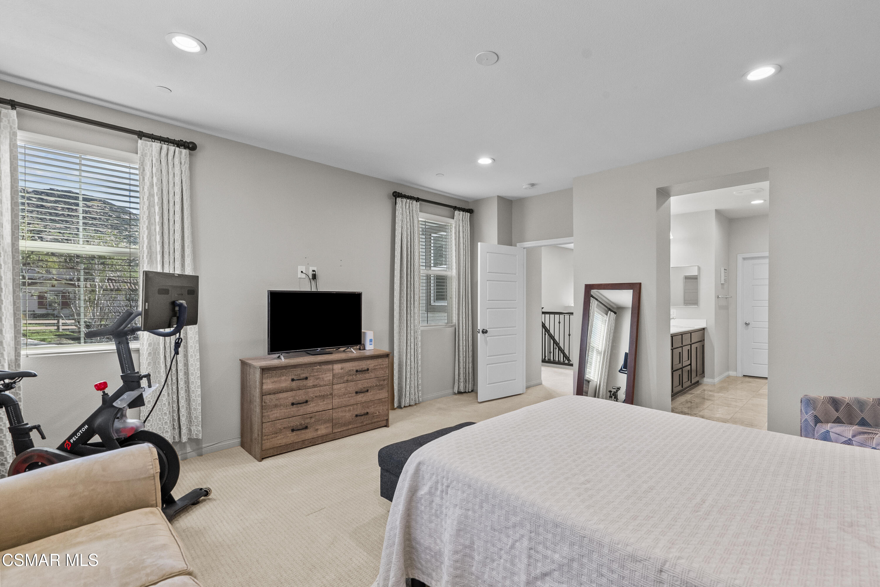 6441 Summit Village Lane, Unit 3 Simi Valley, CA 93063 - Photo 20 of 41 a bedroom with a bed and a flat screen tv