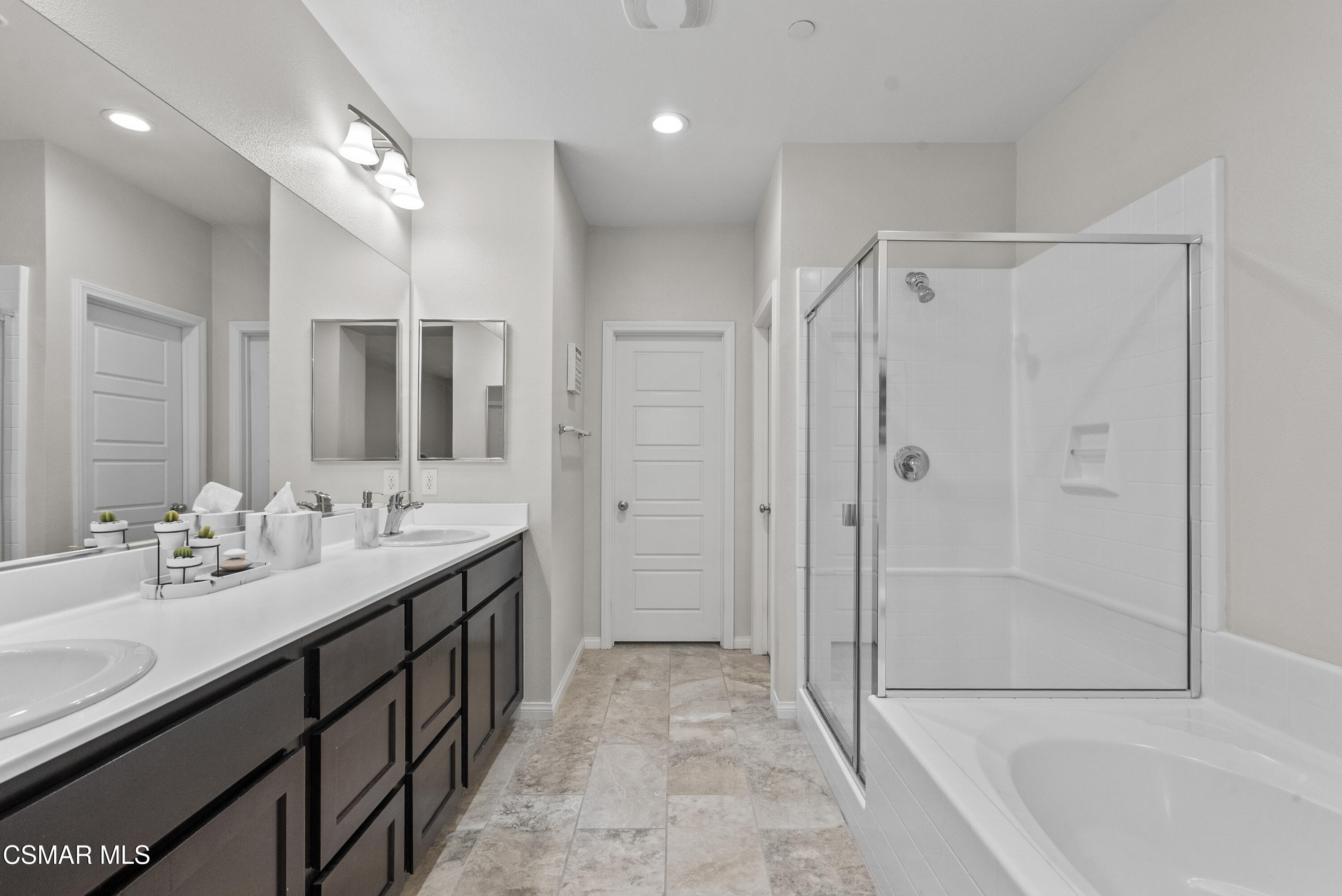 6441 Summit Village Lane, Unit 3 Simi Valley, CA 93063 - Photo 21 of 41 a bathroom with a double vanity sink mirror and shower