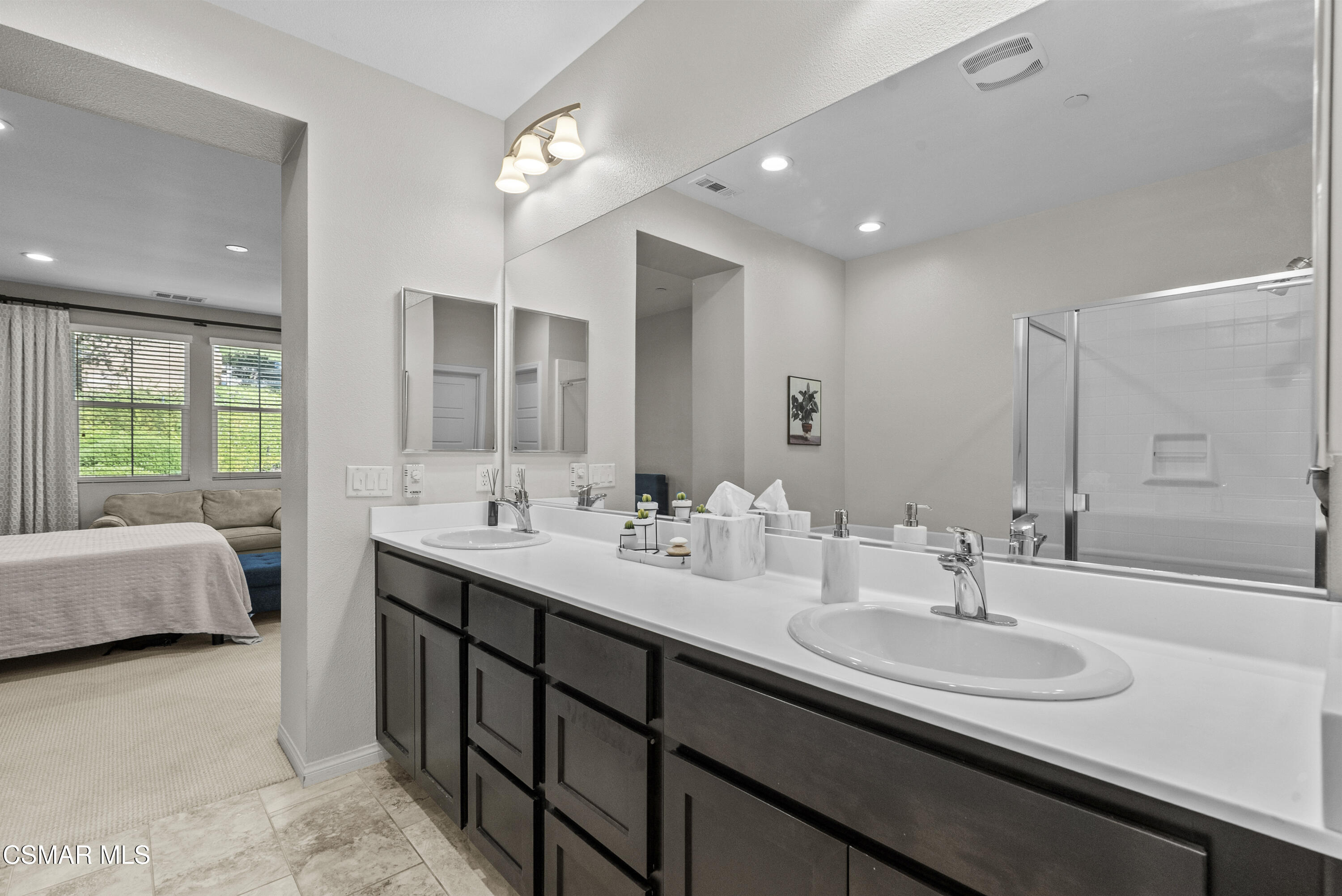 6441 Summit Village Lane, Unit 3 Simi Valley, CA 93063 - Photo 22 of 41 a bathroom with a double vanity sink mirror and double