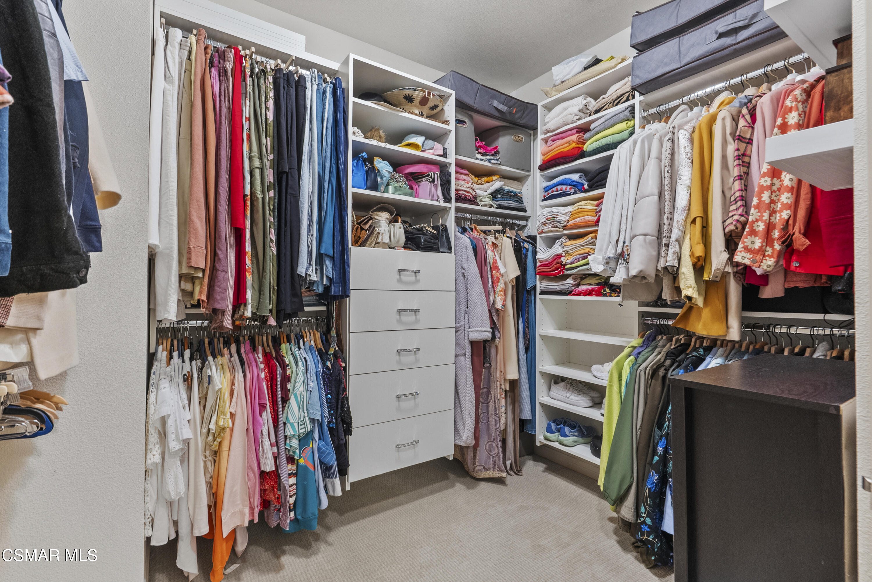6441 Summit Village Lane, Unit 3 Simi Valley, CA 93063 - Photo 23 of 41 a view of walk in closet with clothes and shoes