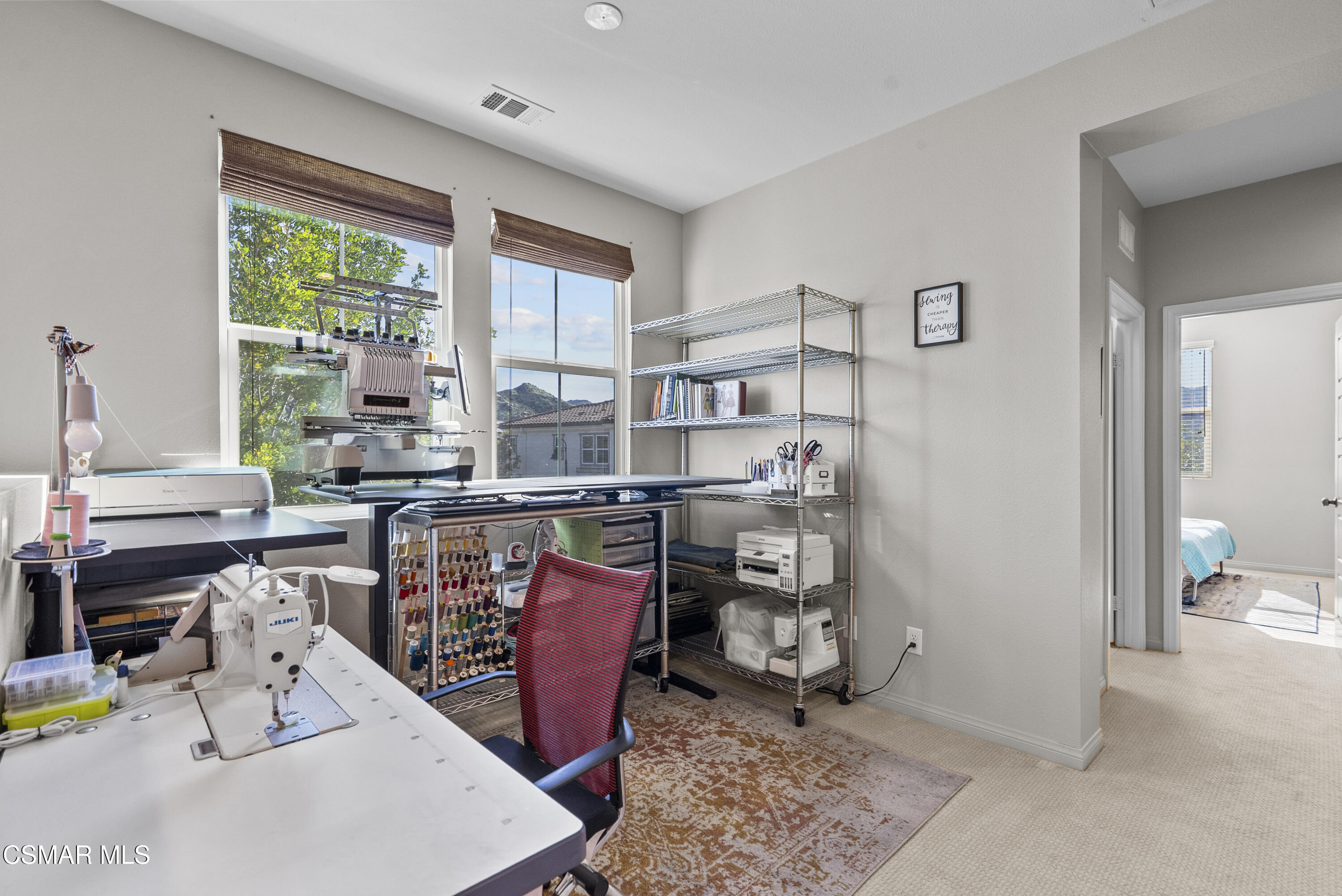 6441 Summit Village Lane, Unit 3 Simi Valley, CA 93063 - Photo 25 of 41 a room with stainless steel appliances kitchen island granite countertop a table chairs in it and a window