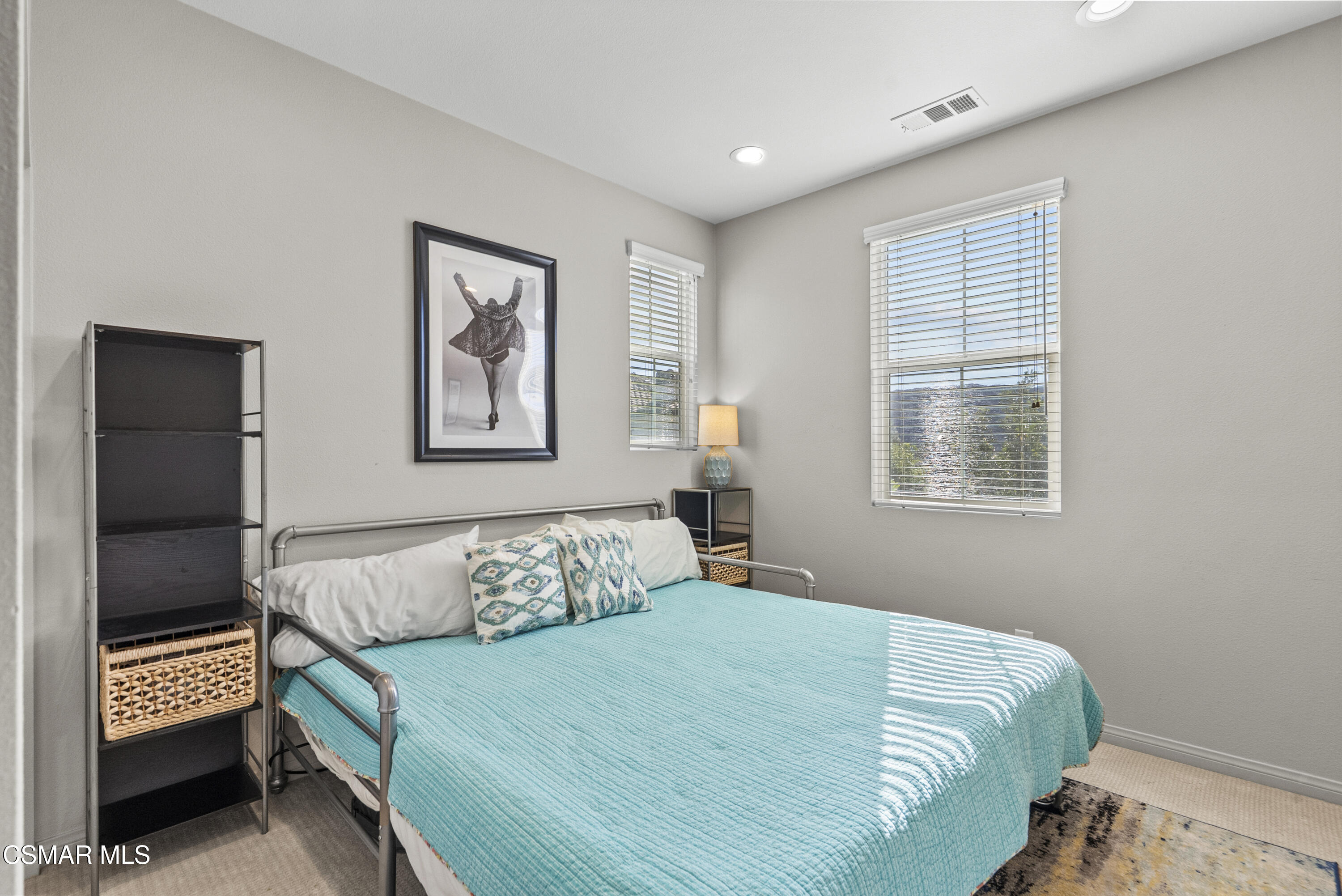 6441 Summit Village Lane, Unit 3 Simi Valley, CA 93063 - Photo 26 of 41 a bedroom with a bed and a window
