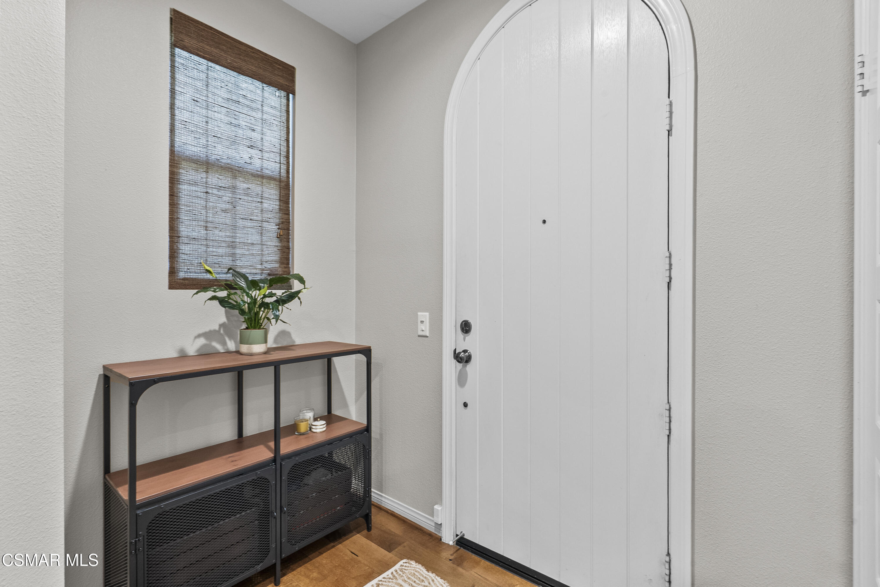 6441 Summit Village Lane, Unit 3 Simi Valley, CA 93063 - Photo 3 of 41 a view of front door with wooden floor