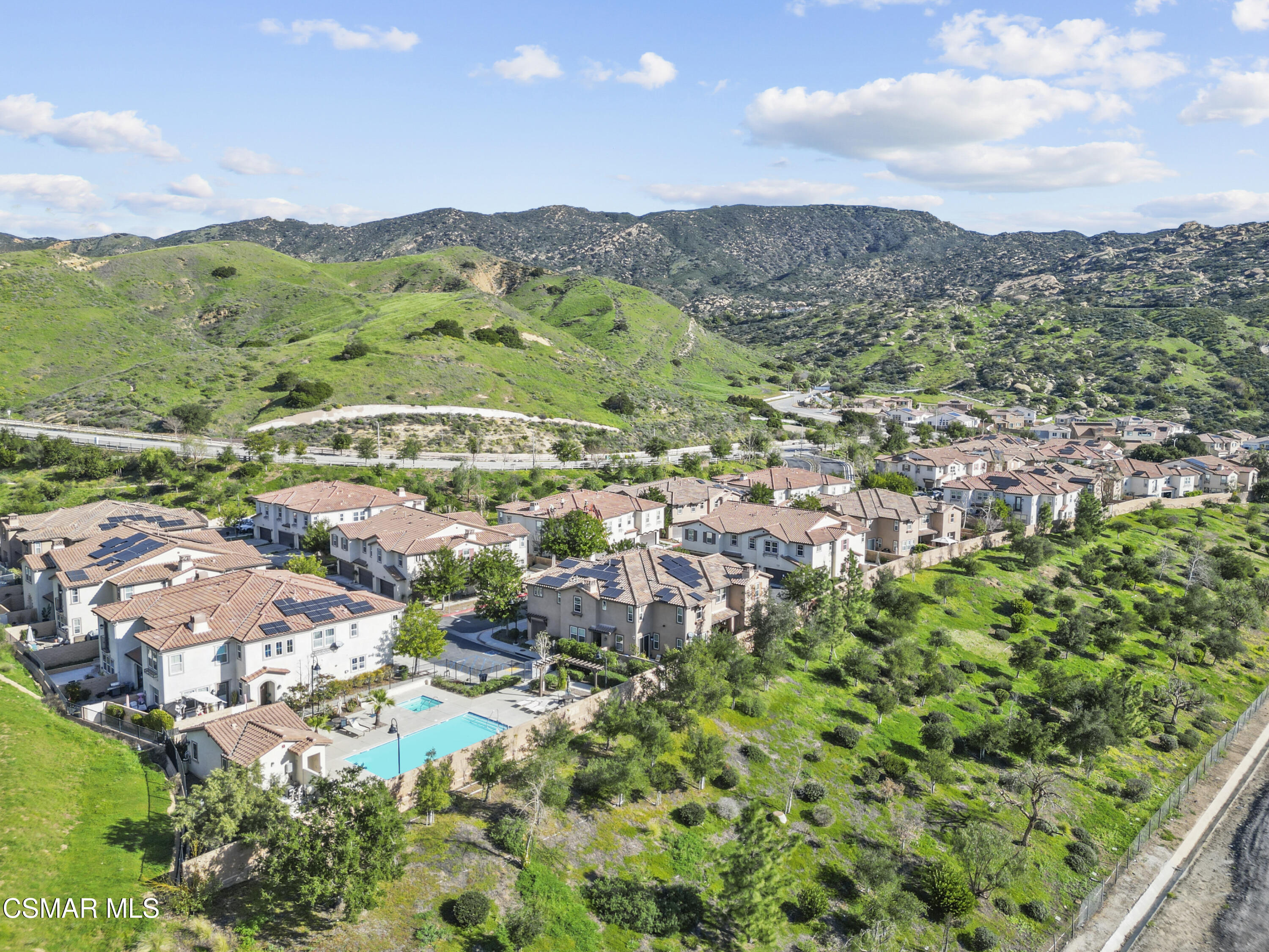 6441 Summit Village Lane, Unit 3 Simi Valley, CA 93063 - Photo 38 of 41 an aerial view of residential houses with outdoor space and trees
