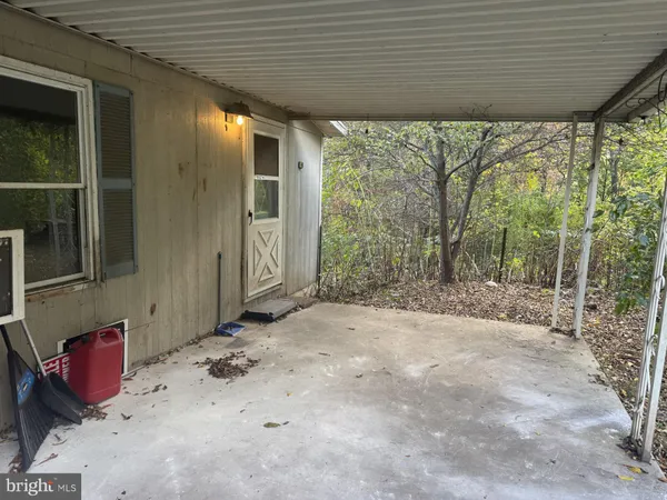 a view of a porch with furniture