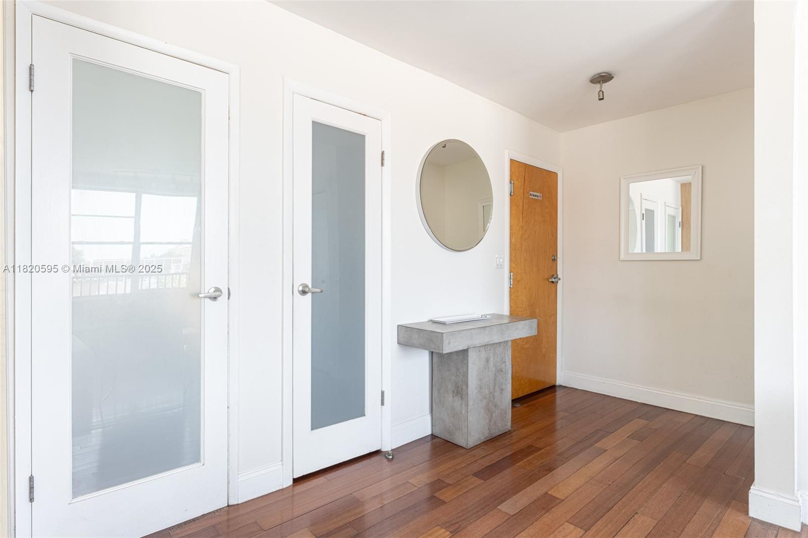 420 15th Street, Unit 307 Miami Beach, FL 33139 - Photo 4 of 22 a view of entryway with wooden floor