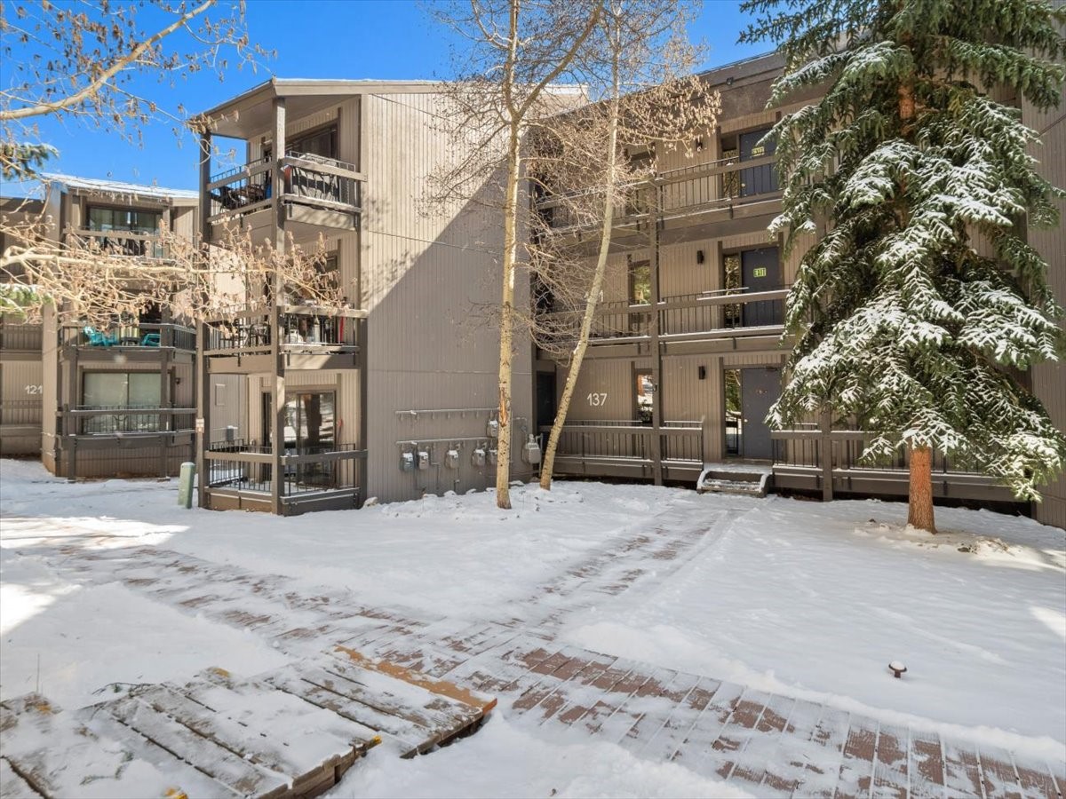1161 Ski Hill Road, Unit 141 Breckenridge, CO 80424 - Photo 21 of 22 a view of a building with a snow