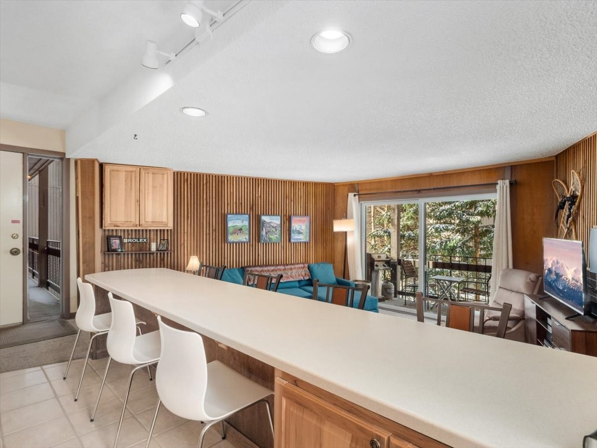 1161 Ski Hill Road, Unit 141 Breckenridge, CO 80424 - Photo 4 of 22 a large kitchen with a large window and stainless steel appliances