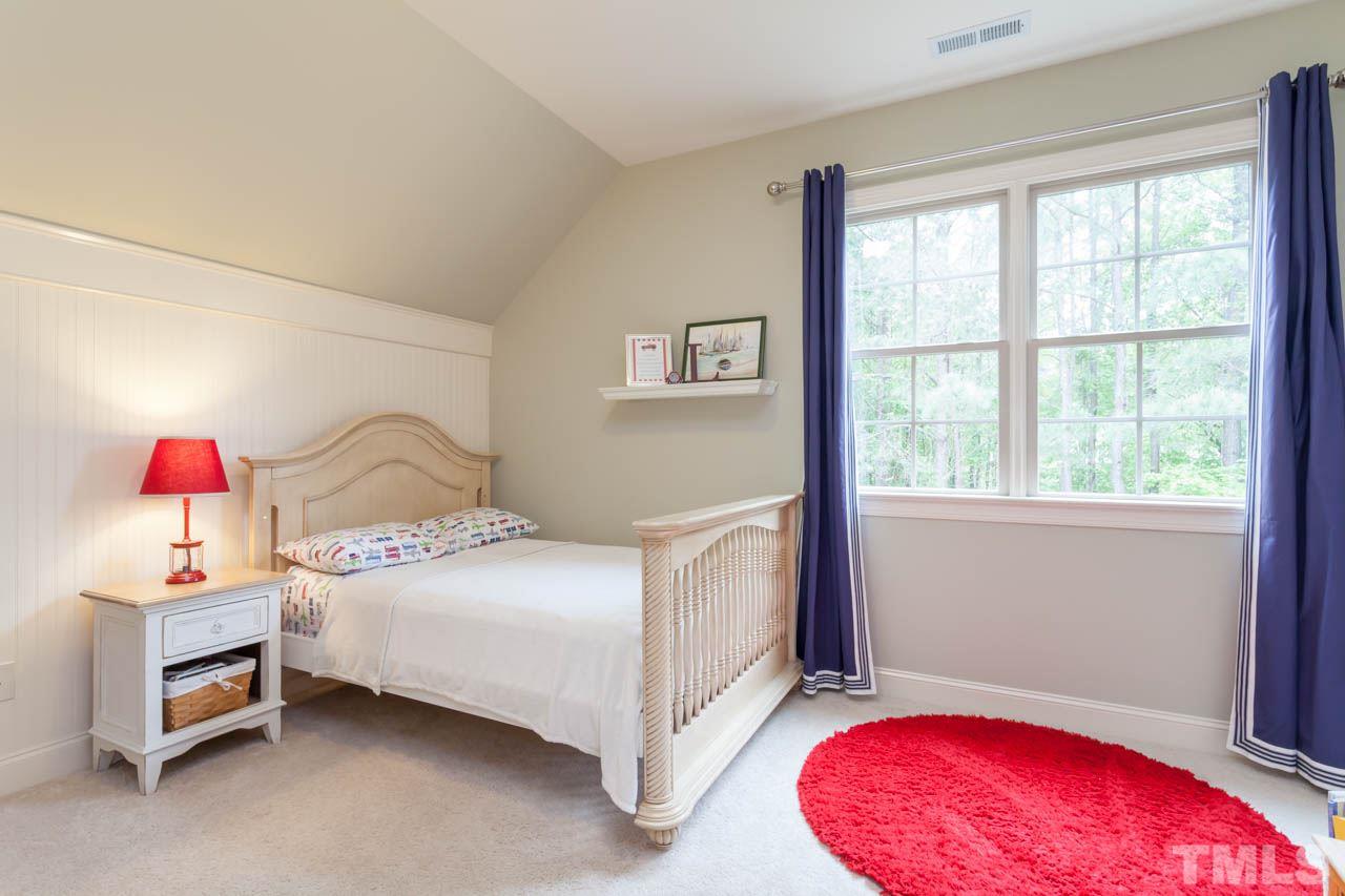 14604 Norwood Road Raleigh, NC 27614 - Photo 14 of 25 a bedroom with a bed and a window