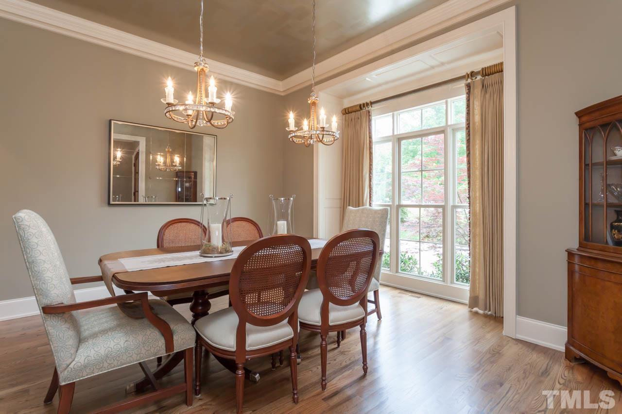 14604 Norwood Road Raleigh, NC 27614 - Photo 3 of 25 a view of a dining room with furniture window and wooden floor