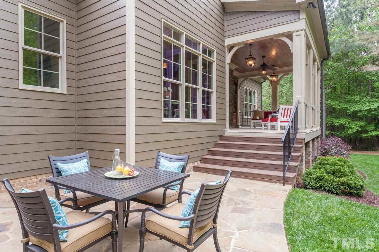14604 Norwood Road Raleigh, NC 27614 - Photo 22 of 25 a view of a house with a dining table and chairs