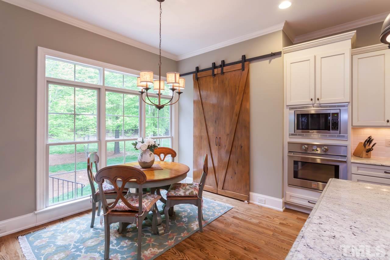 14604 Norwood Road Raleigh, NC 27614 - Photo 8 of 25 a view of a dining room with furniture window and outside view