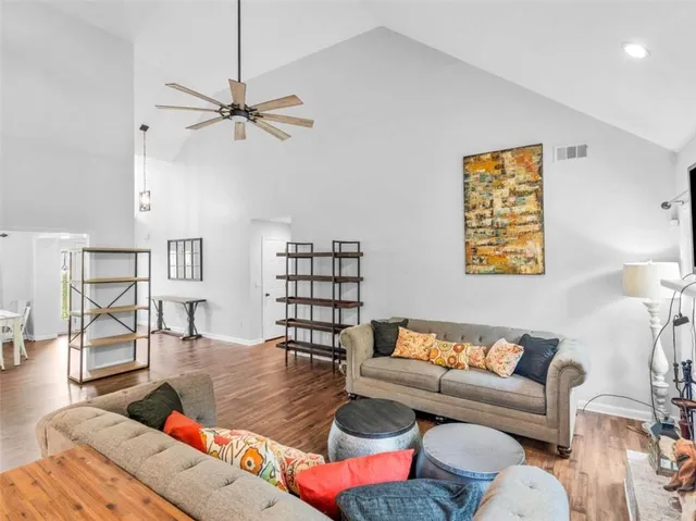 a kitchen with stainless steel appliances granite countertop a sink a stove and a granite counter tops