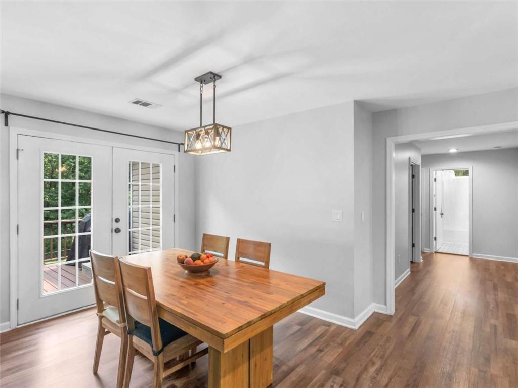 545 Barhams Ridge Drive McDonough, GA 30252 - Photo 13 of 62 a view of a dining room with furniture window and wooden floor