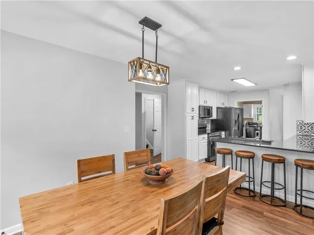 a bedroom with two beds and a window