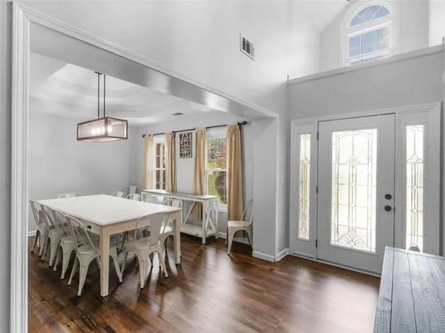 a view of a dining room with furniture window and wooden floor