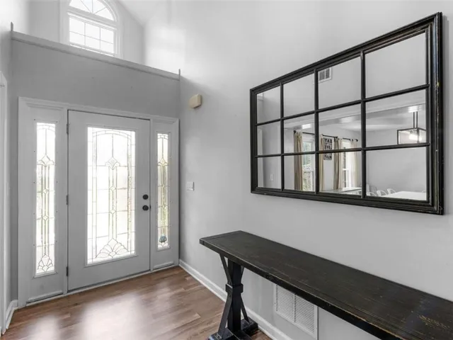 a view of a dining room and a wooden floor