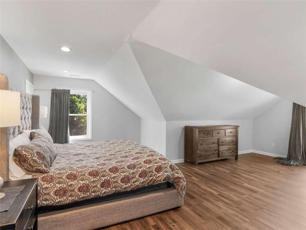 545 Barhams Ridge Drive McDonough, GA 30252 - Photo 46 of 62 a bedroom with a large bed and a window