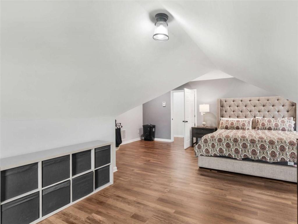 545 Barhams Ridge Drive McDonough, GA 30252 - Photo 48 of 62 a living room with furniture a ceiling fan and a rug