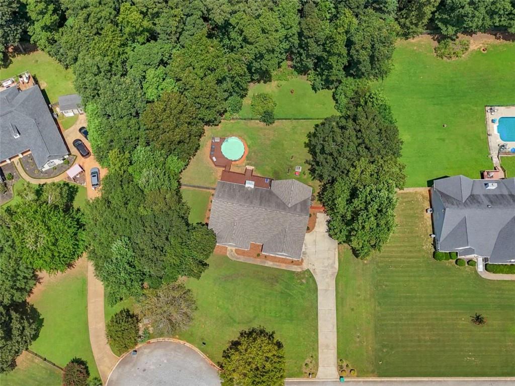 545 Barhams Ridge Drive McDonough, GA 30252 - Photo 60 of 62 an aerial view of a house with a yard basket ball court and outdoor seating
