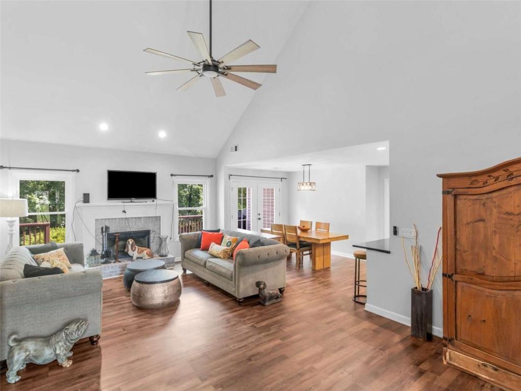 545 Barhams Ridge Drive McDonough, GA 30252 - Photo 9 of 62 a living room with furniture flat screen tv and a fireplace