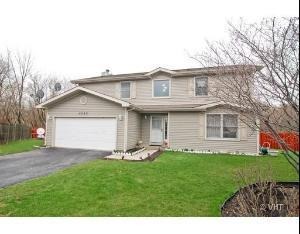 5353 Joshua Court Gurnee, IL 60031 - Photo 1 of 22 a front view of house with yard and green space