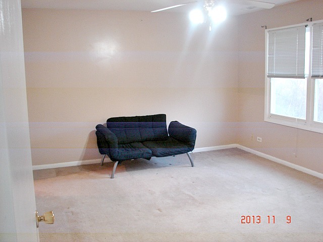 5353 Joshua Court Gurnee, IL 60031 - Photo 14 of 22 a room with furniture and a window
