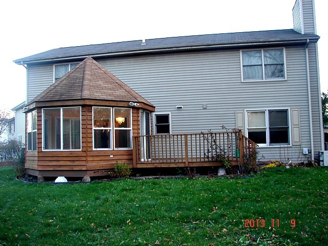 5353 Joshua Court Gurnee, IL 60031 - Photo 22 of 22 a front view of a house with a garden