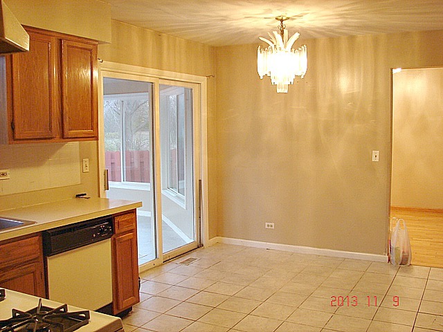 5353 Joshua Court Gurnee, IL 60031 - Photo 6 of 22 a view of a bathroom with a shower and a sink